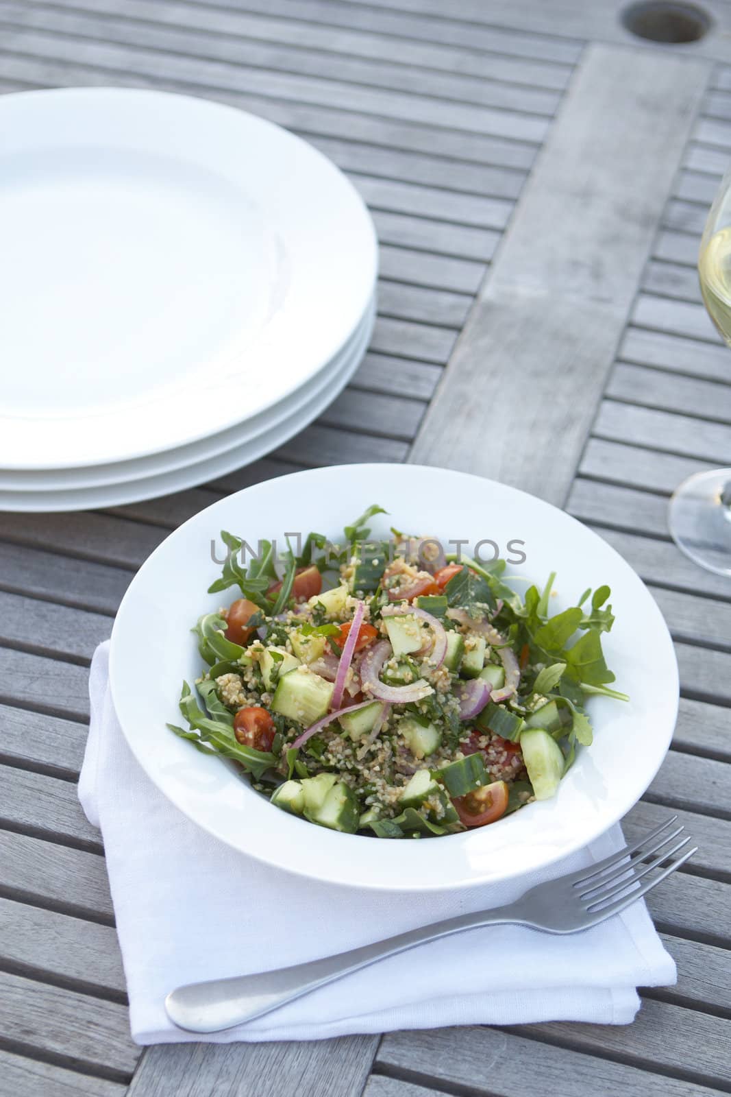 Healthy eating. Couscous salad on outdoor table
