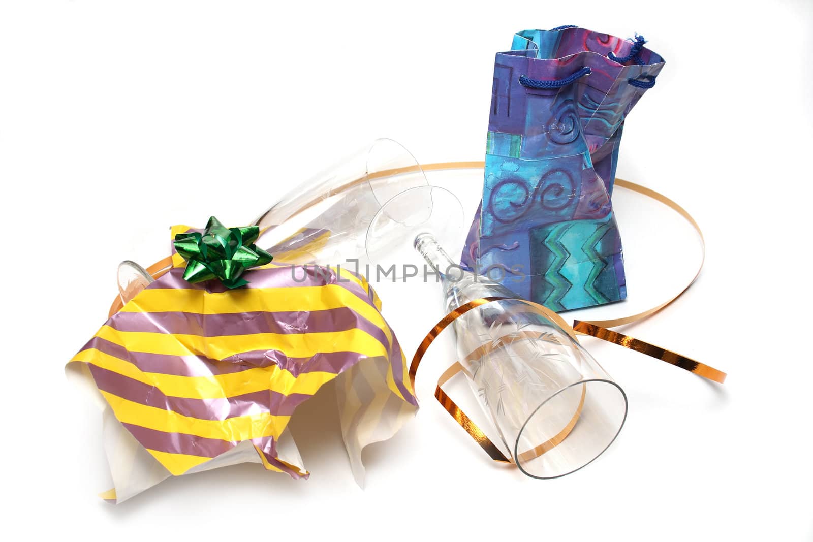 Crumpled wrapping and empty glasses by Gdolgikh