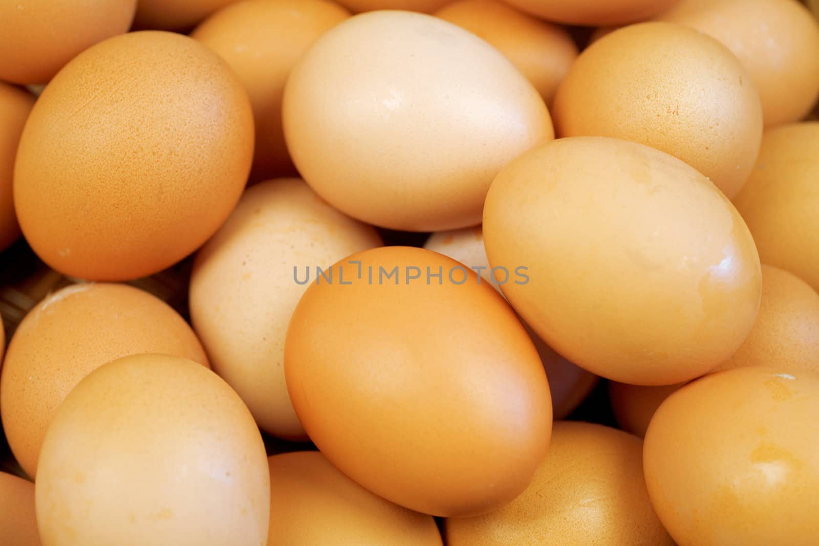 food background from a brown and yellow eggs