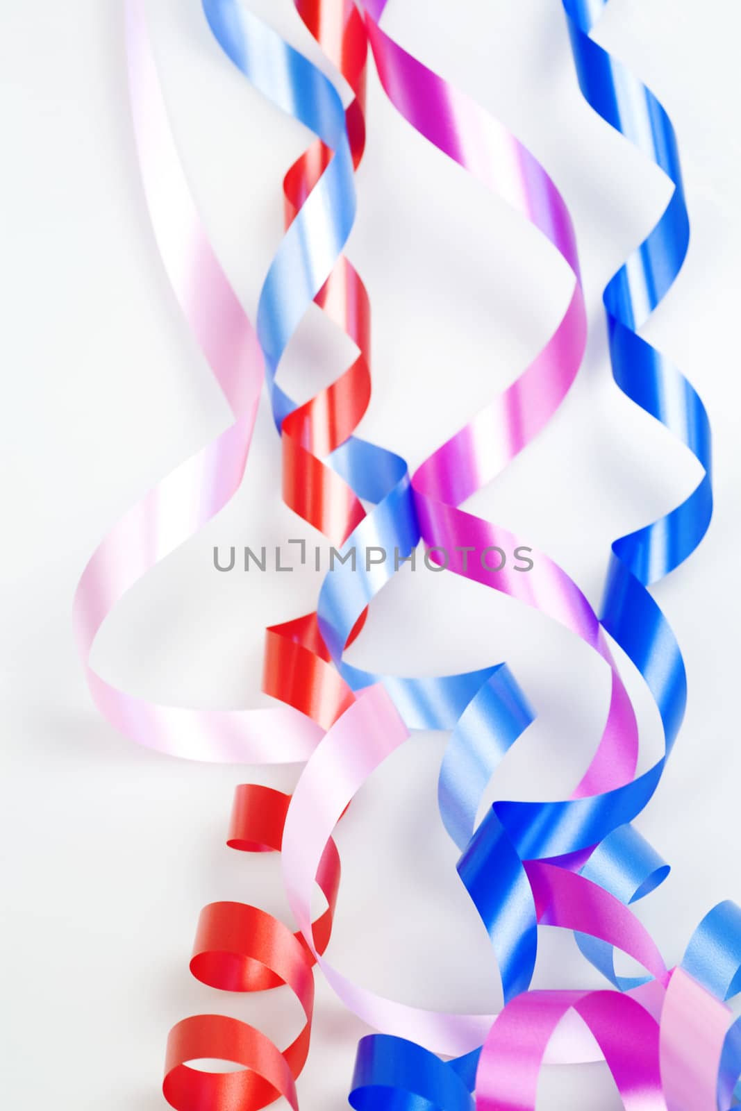 varicolored decorative ribbons on a white background