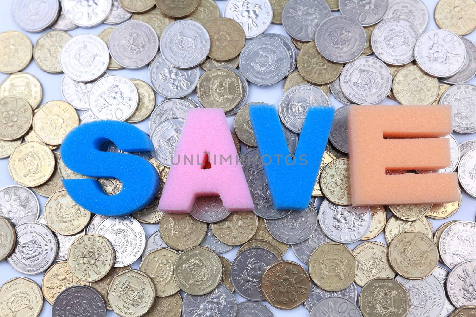 Save word spelled out on a backdrop of coins