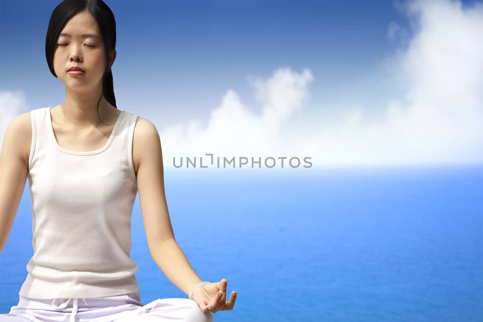 yoga woman with blue ocean background by tomwang