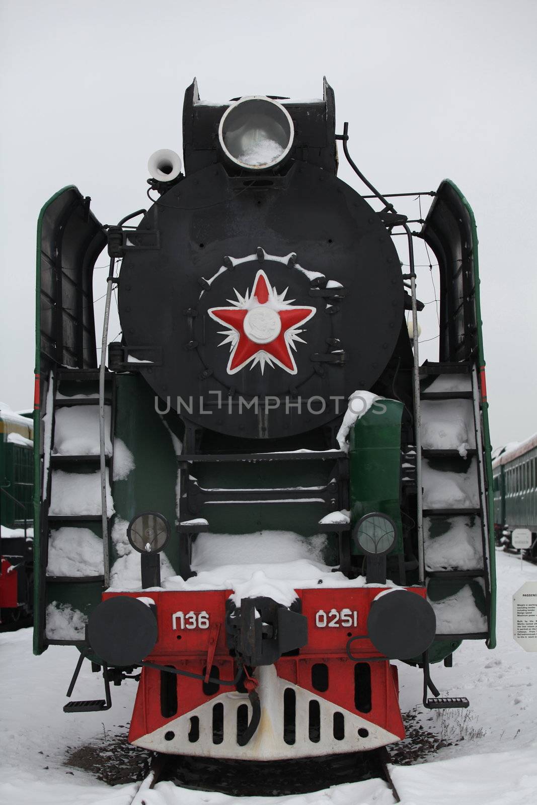 old locomotive at a train station in winter