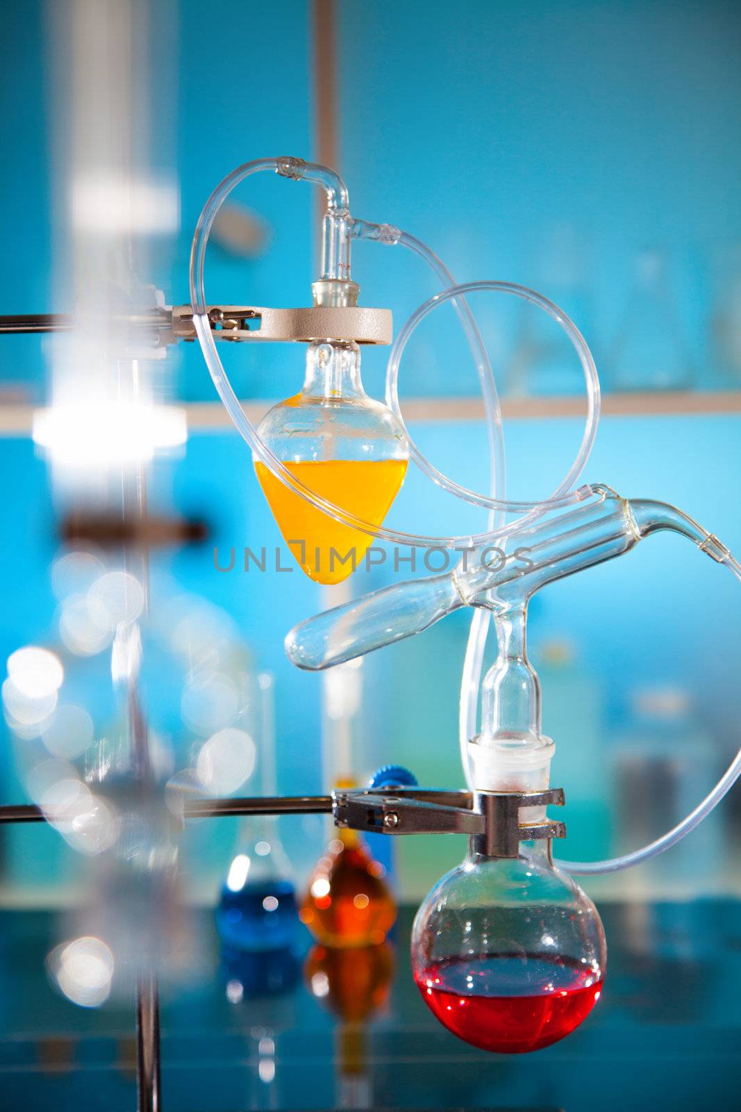 glass laboratory apparatus with liquid samples by motorolka
