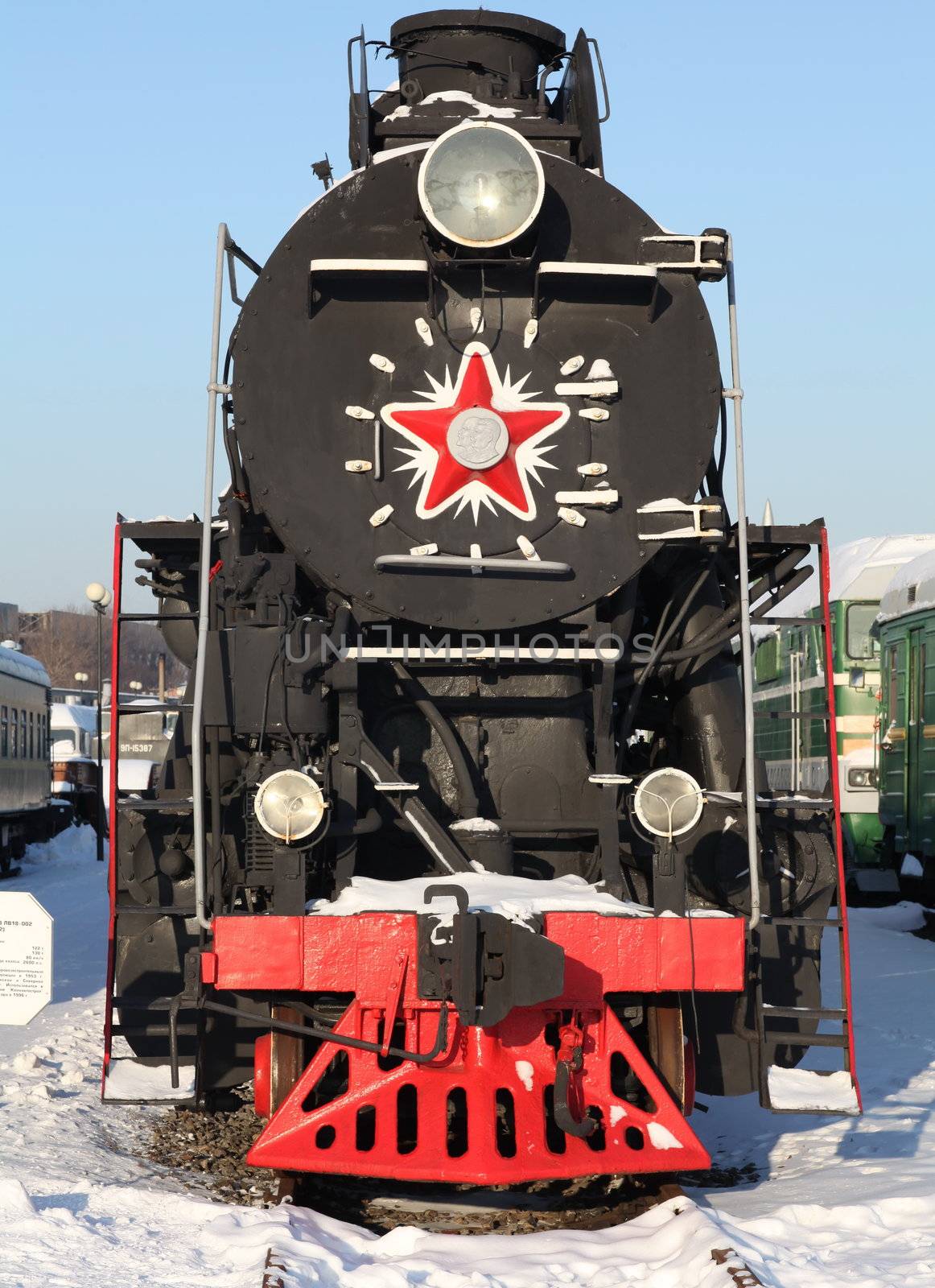 old locomotive at a train station in winter
