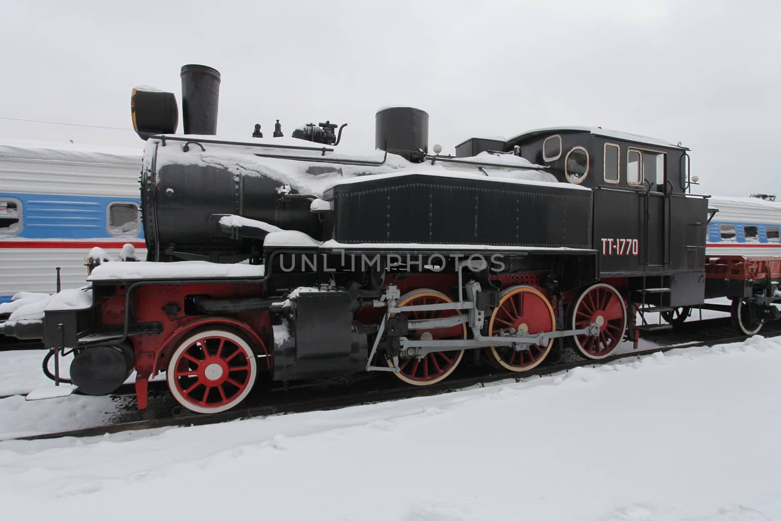 old locomotive at a train station in winter