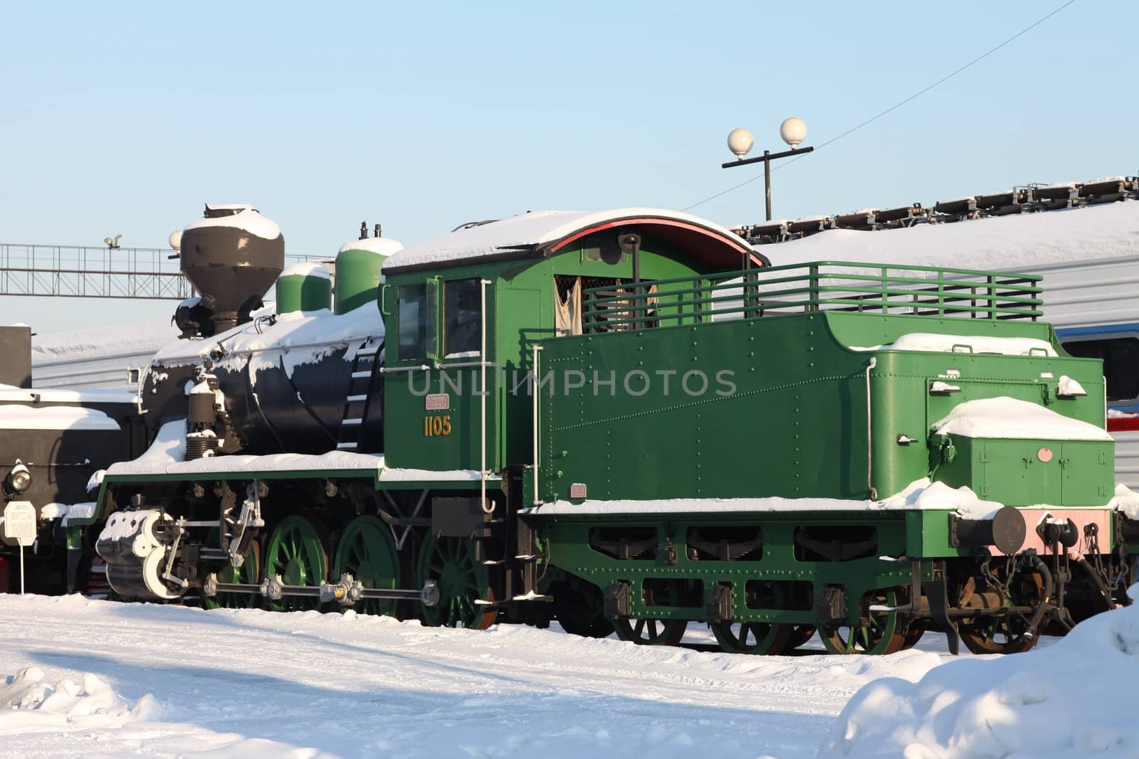 old locomotive at a train station in winter
