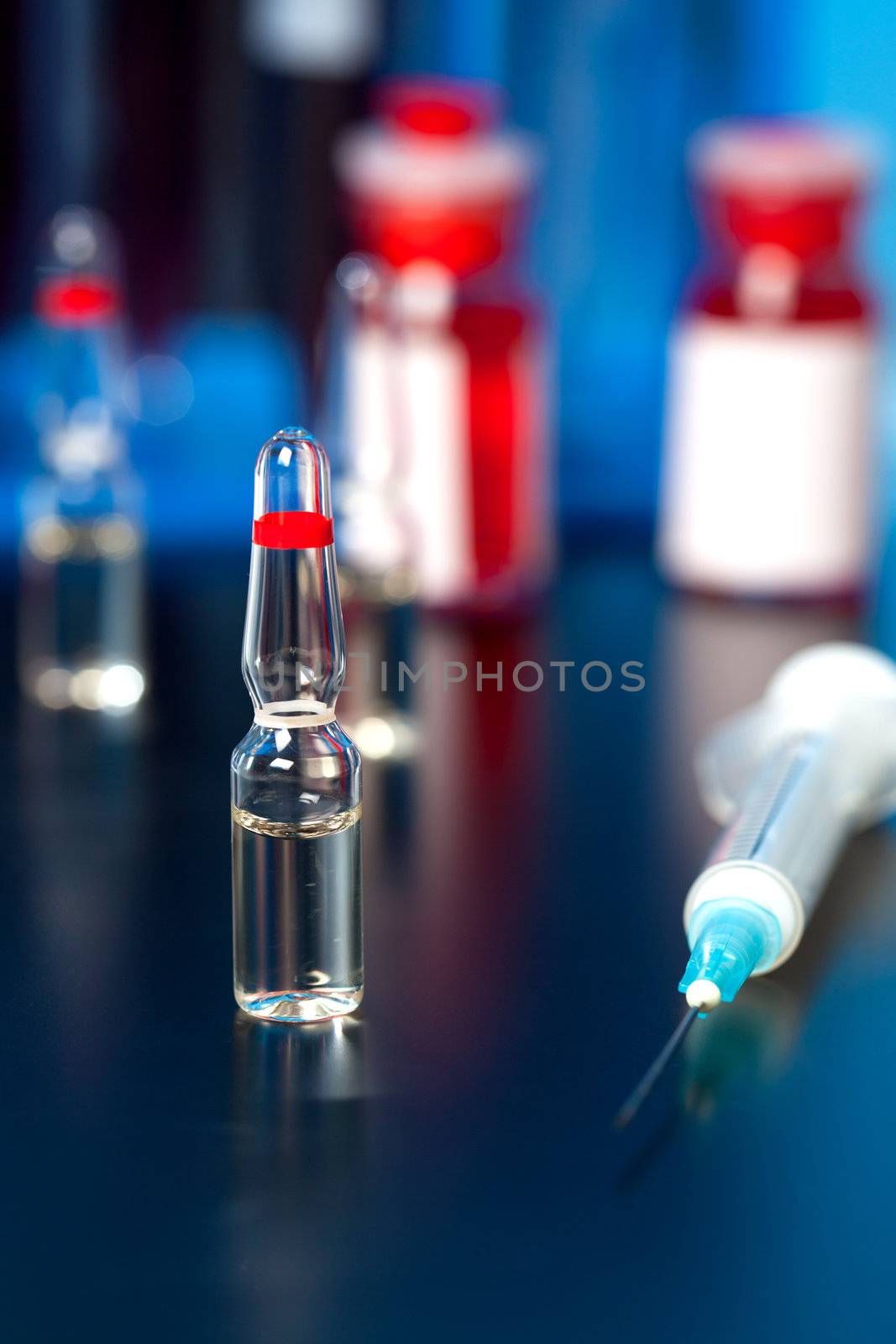 medical ampoule and syringe. Vials of medications. by motorolka