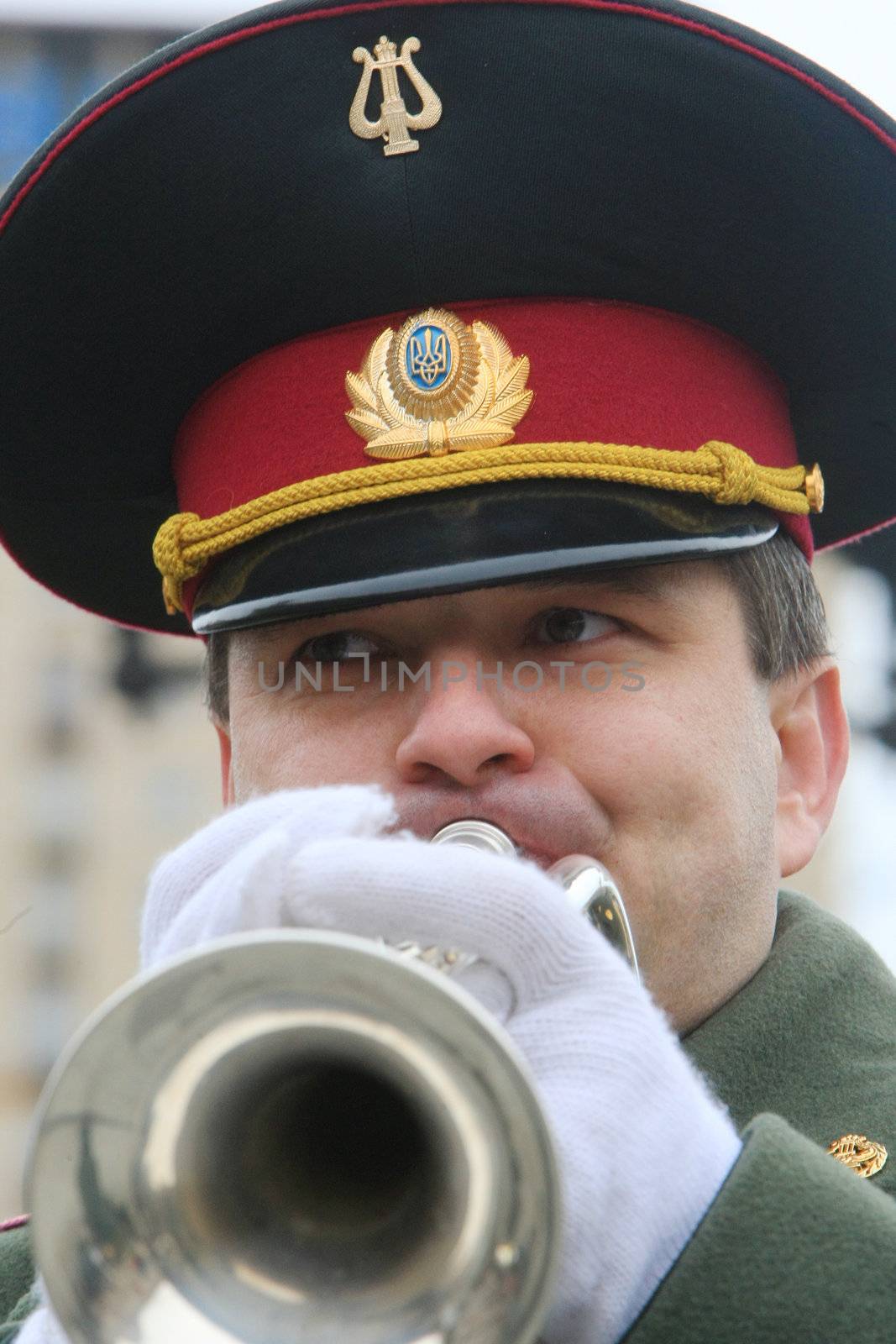 KYIV, UKRAINEA  - FEB 23: military musician plays during the orchestra parade dedicated to the Motherland Defender Day celebrations on  Independence Square February on 23, 2008 in Kyiv, Ukraine