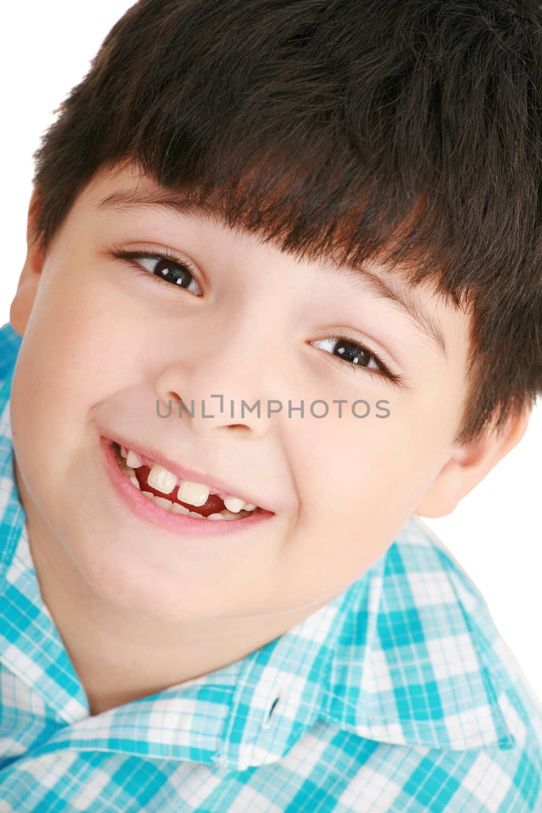 Photo of adorable young boy looking at camera