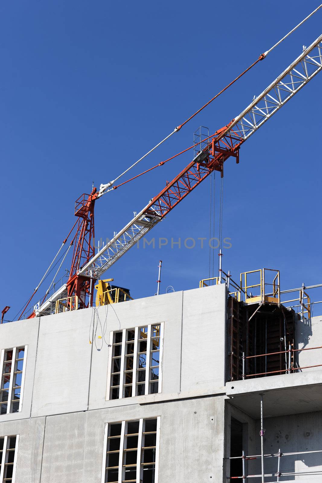 Construction site with crane in blue sky