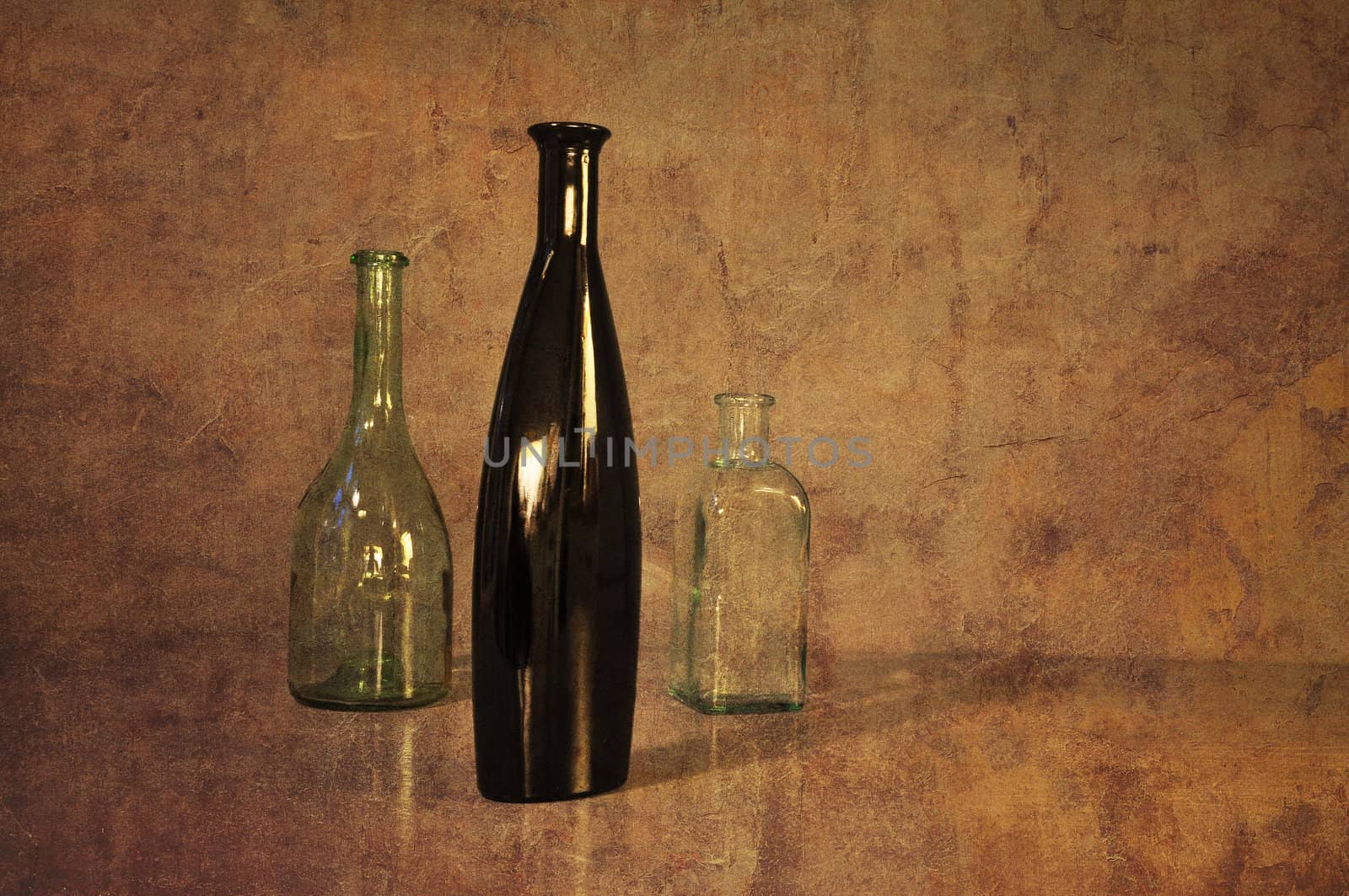 Three bottles, a black one at the front symbolizing leadership, power,  strength. Vintage look.