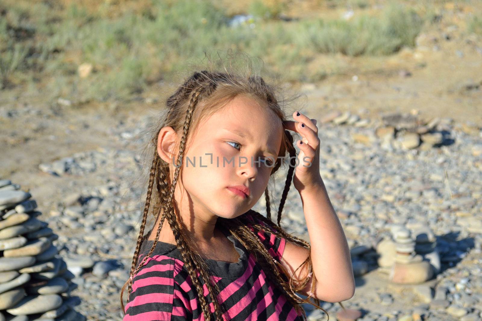 thoughtful girl with braids