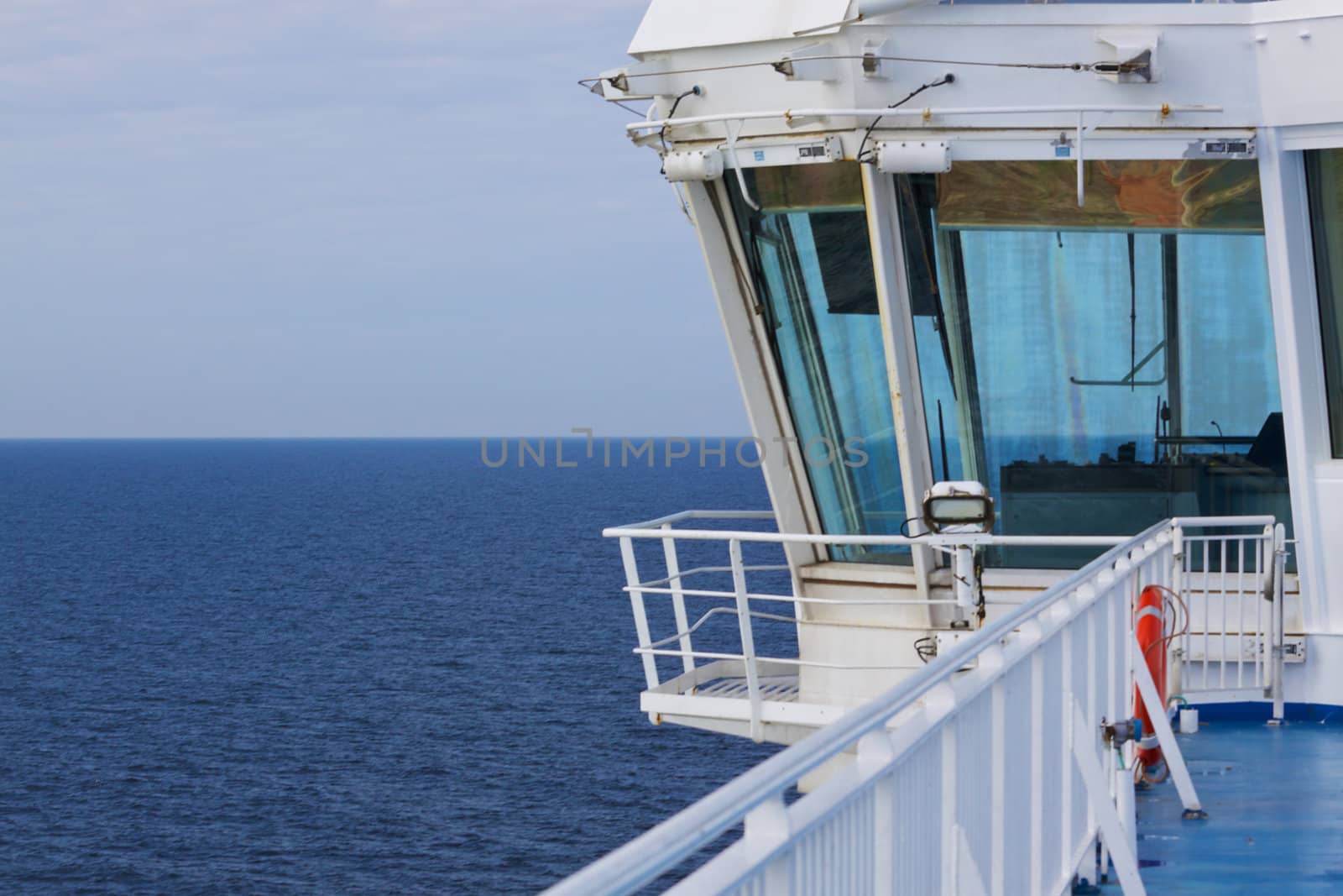 Captain bridge on freight ferry sailing on open sea