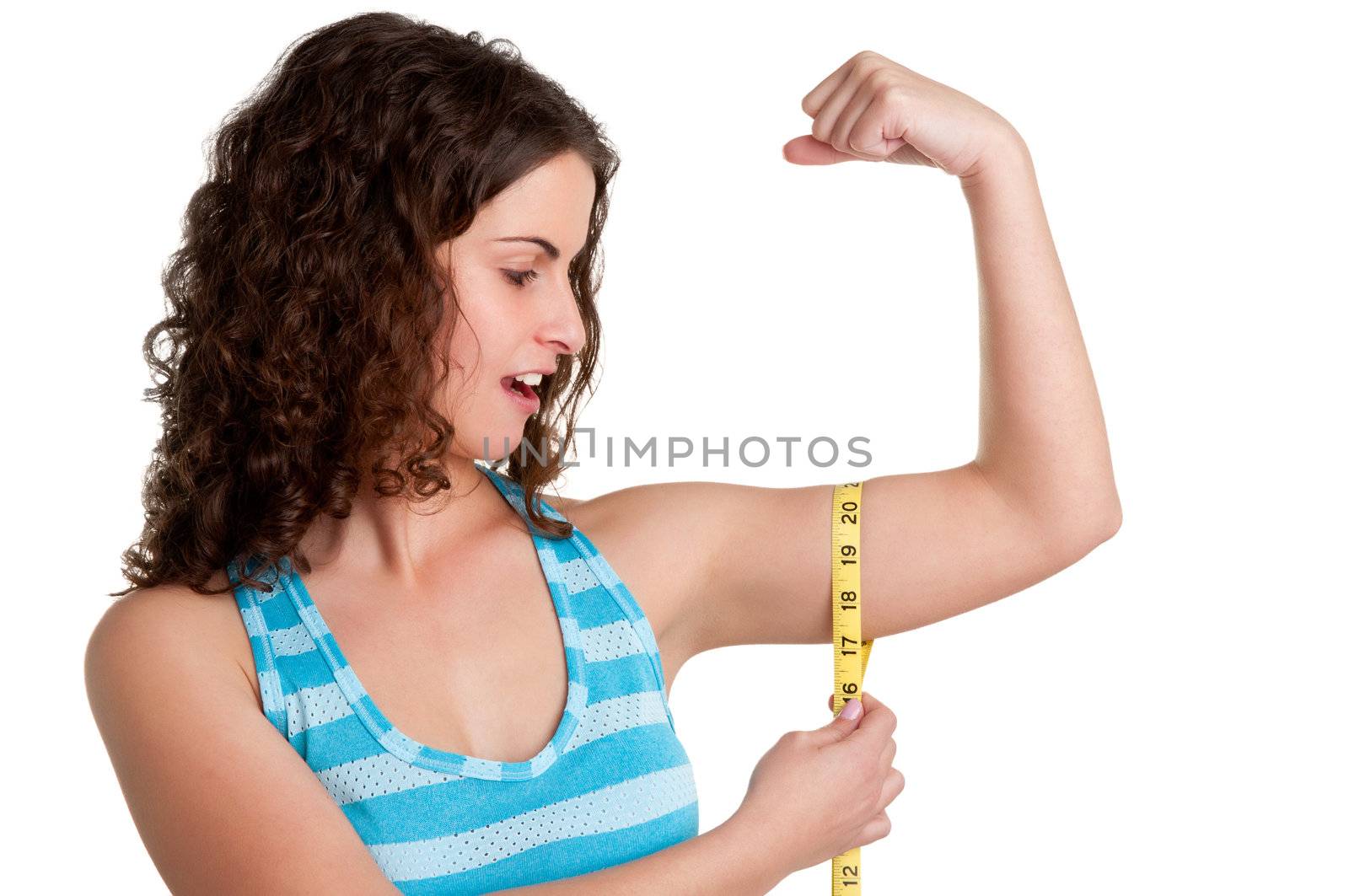 Surprised woman measuring her Biceps, isolated in a white background