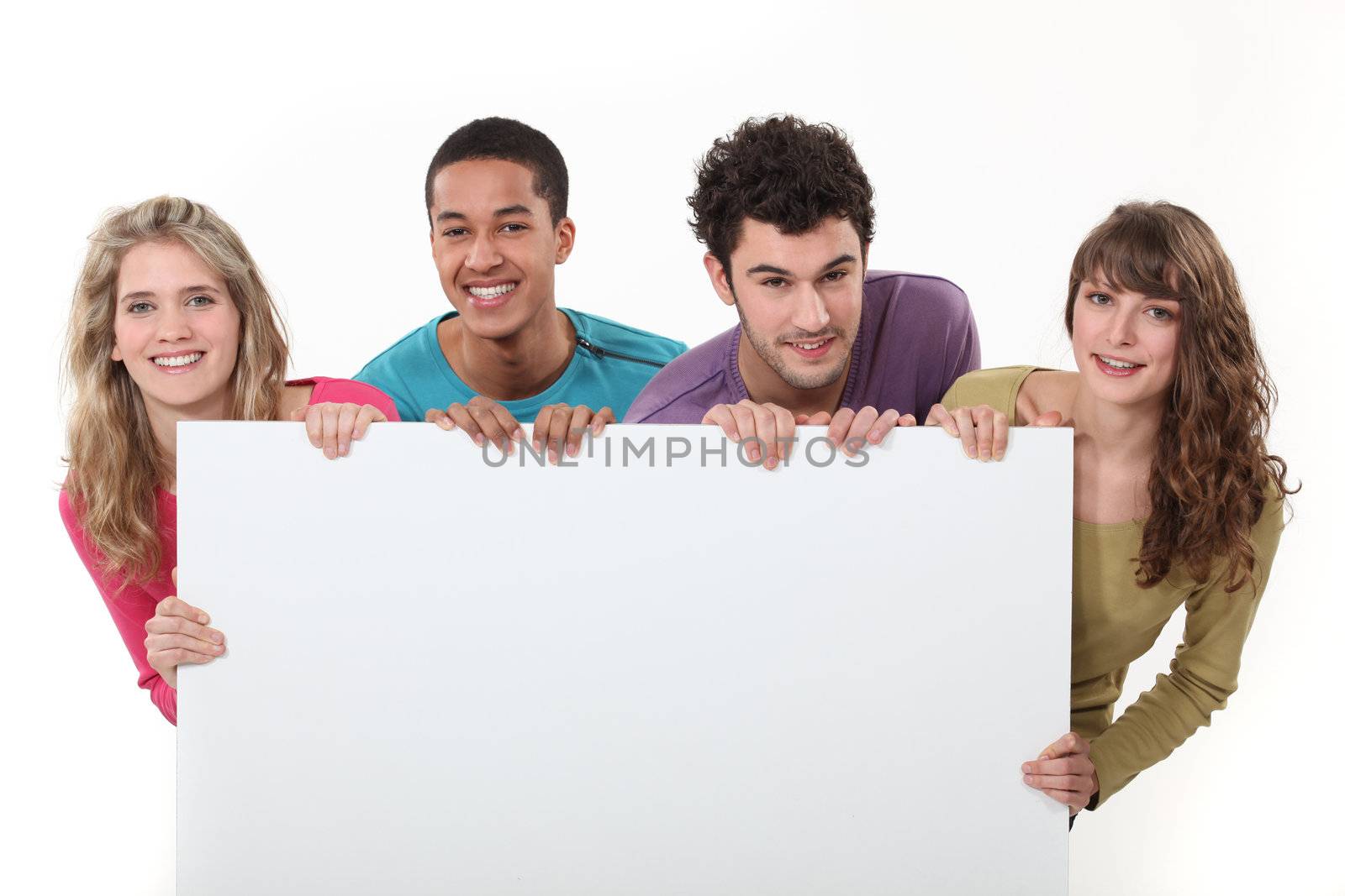 Teenagers holding up a blank sign