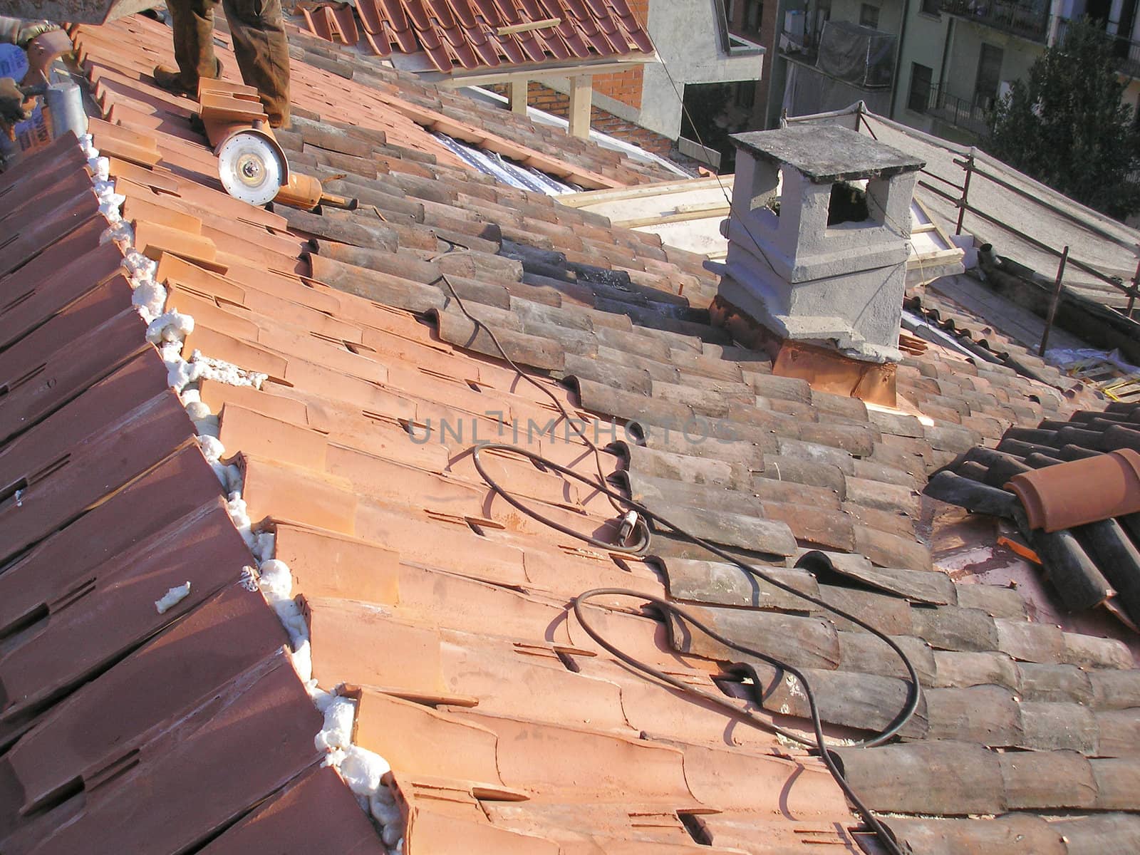 Working on a roof at a building site