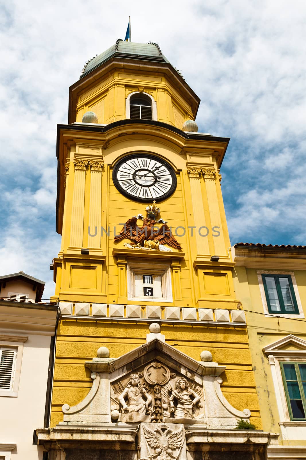 Yellow Clock Tower with Relief in Rijeka, Croatia