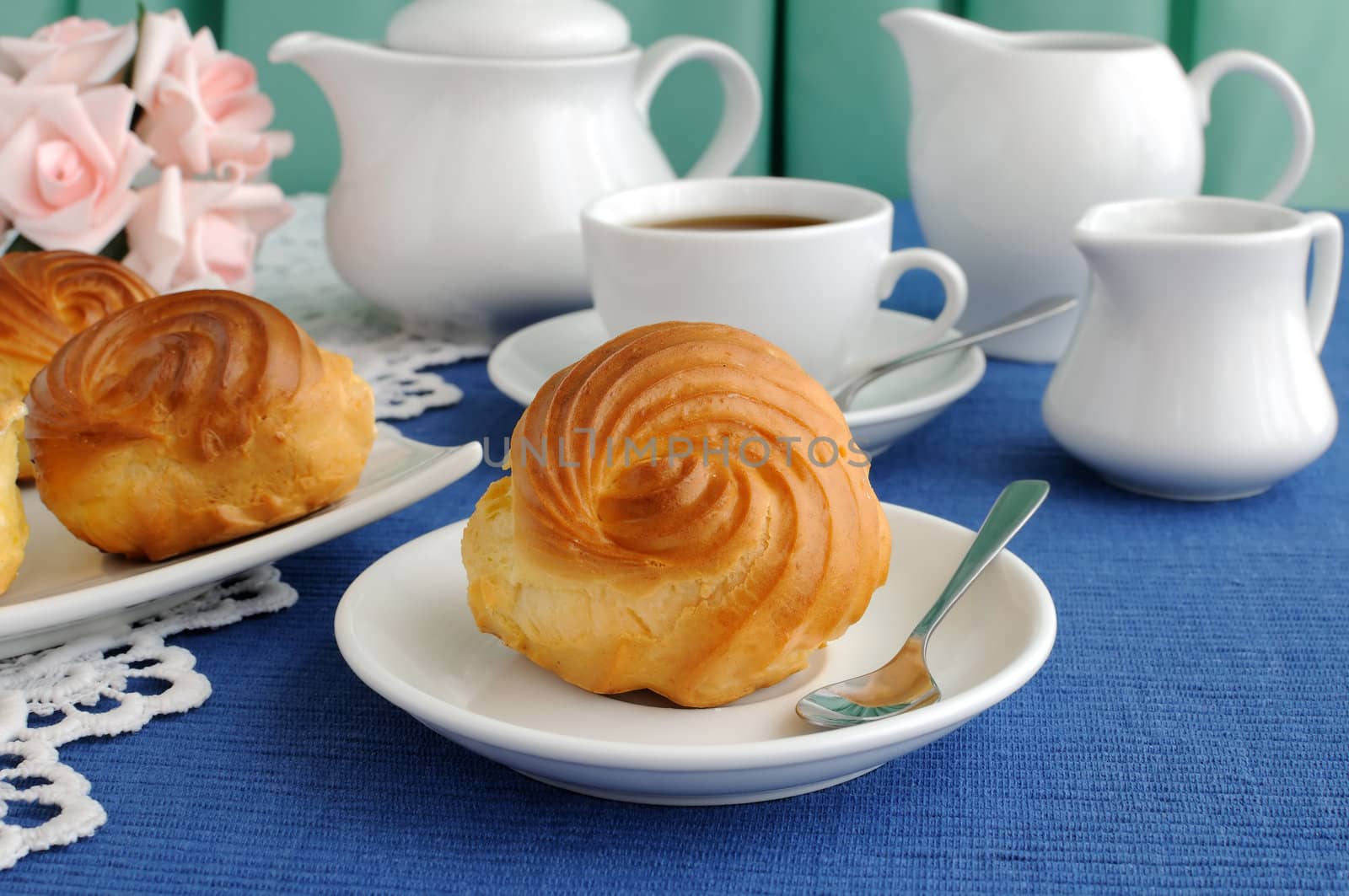 Eclairs with a cup of coffee by Apolonia