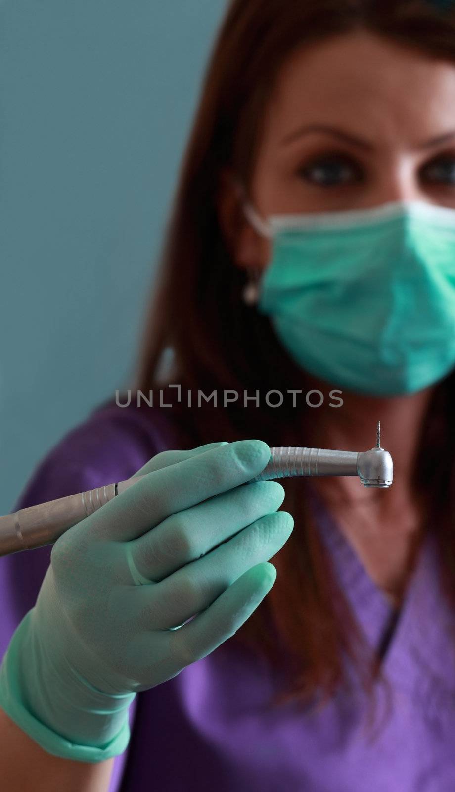 Dentist with drill by RazvanPhotography