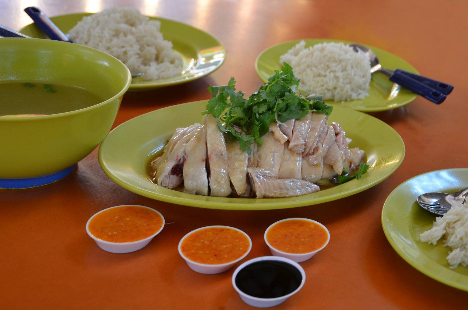 Thai gourmet steamed chicken and  rice served with delicious soup and sauce