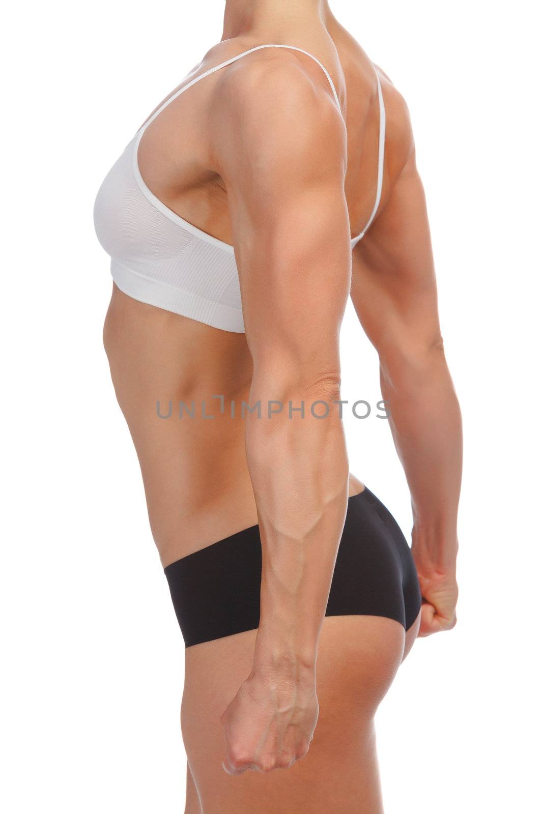 Female fitness bodybuilder posing against white background