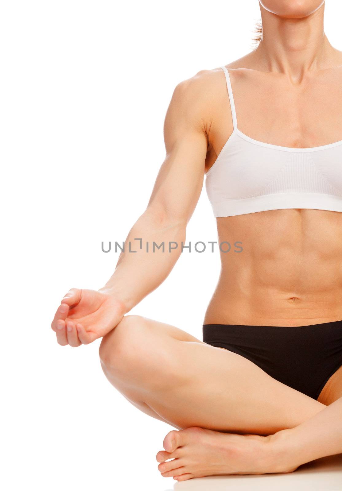 Muscular woman doing yoga exercise, isolated on white background