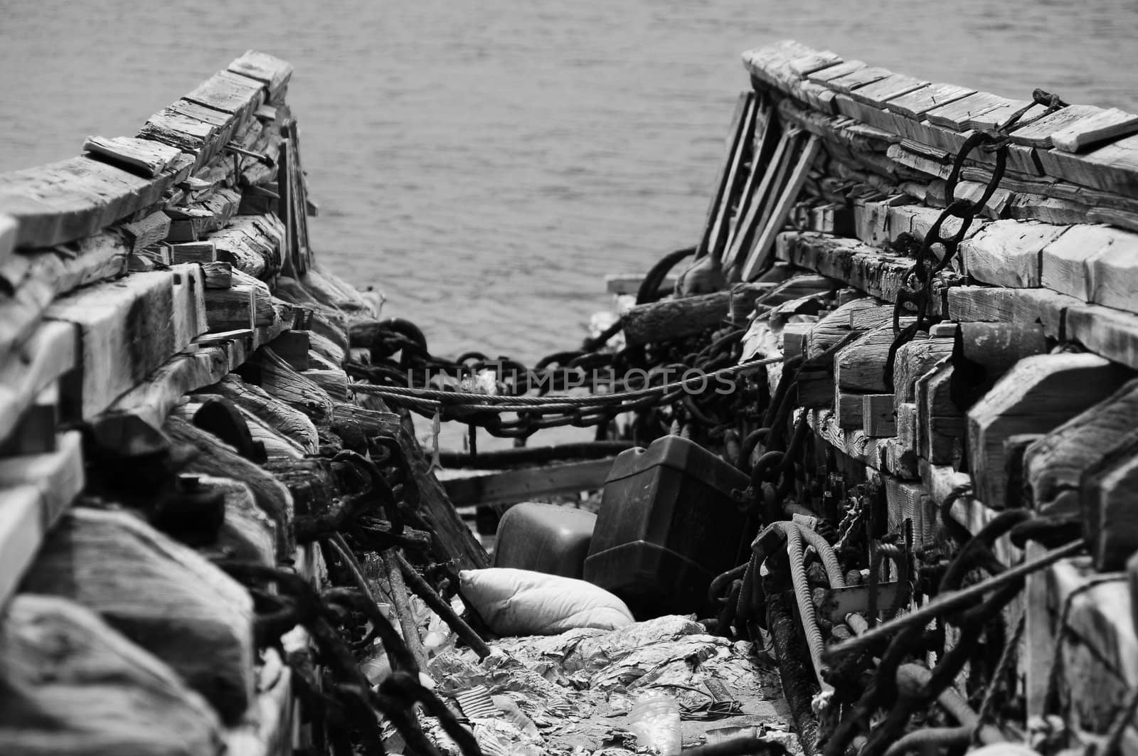 The wrackage of an old boat abandoned in a harbour