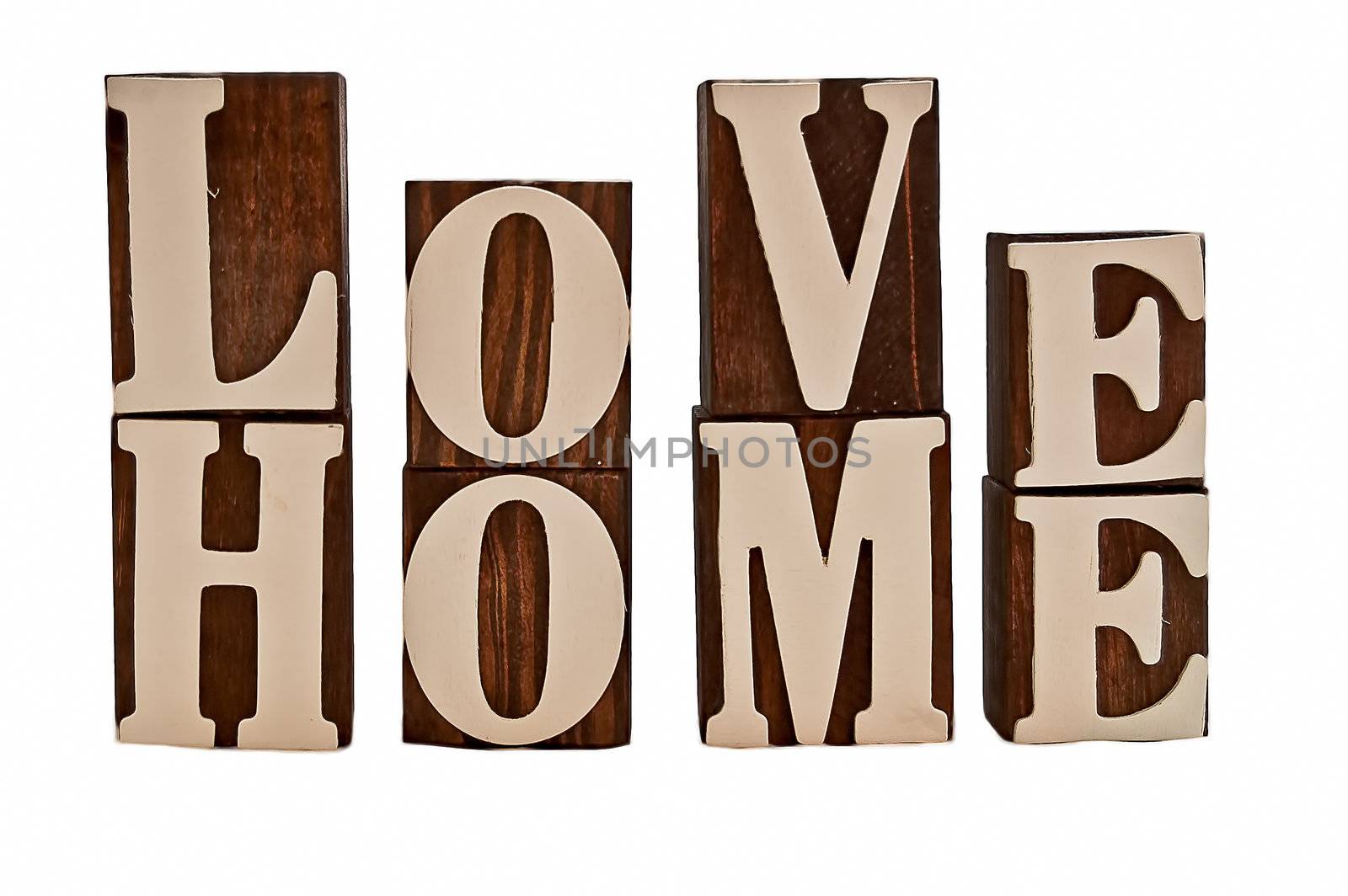 isolated over white rough edged wooden blocks spelling out love home (intentionally grundgy)