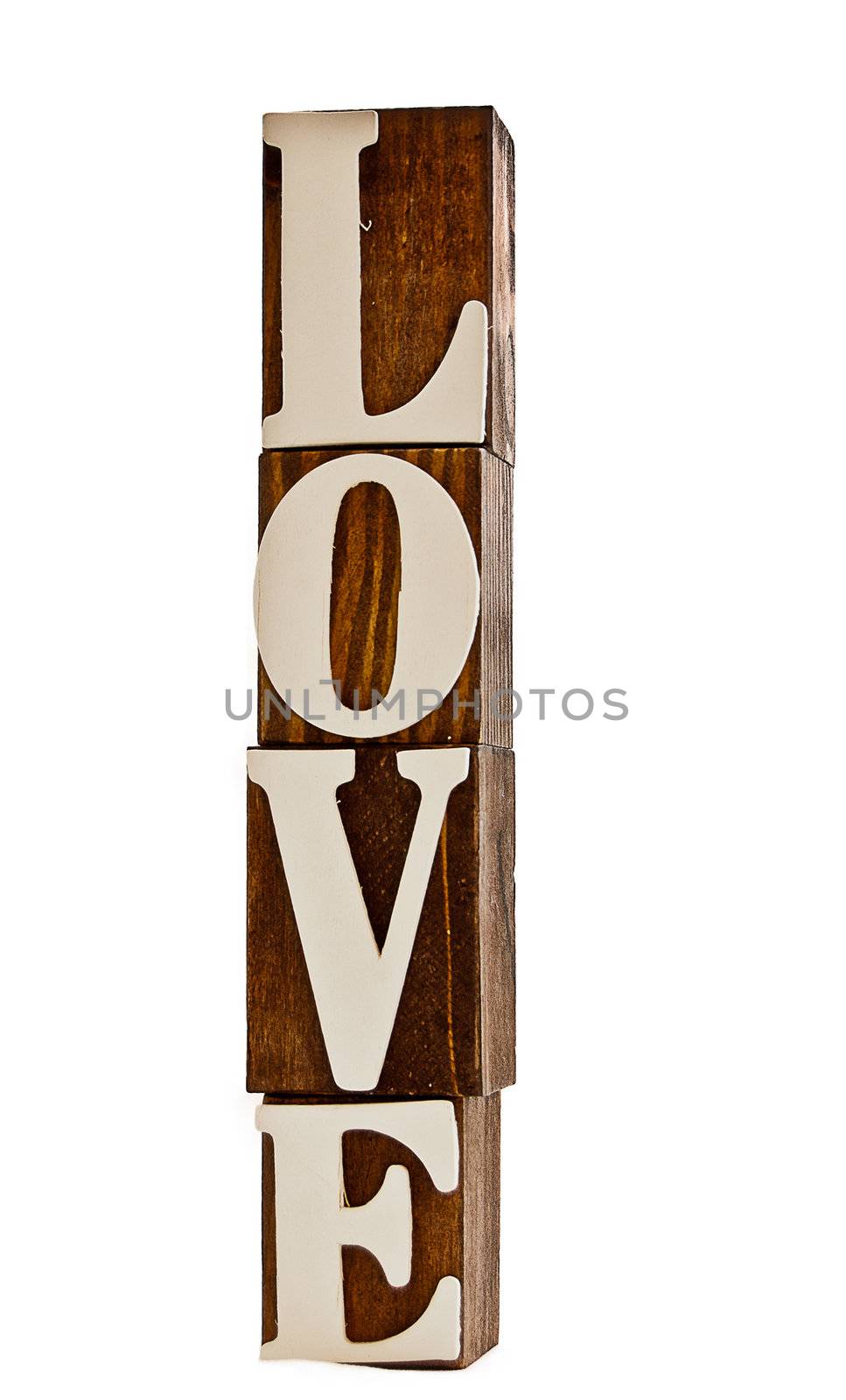 grungy wooden blocks spelling LOVE standing upright isolated over white 