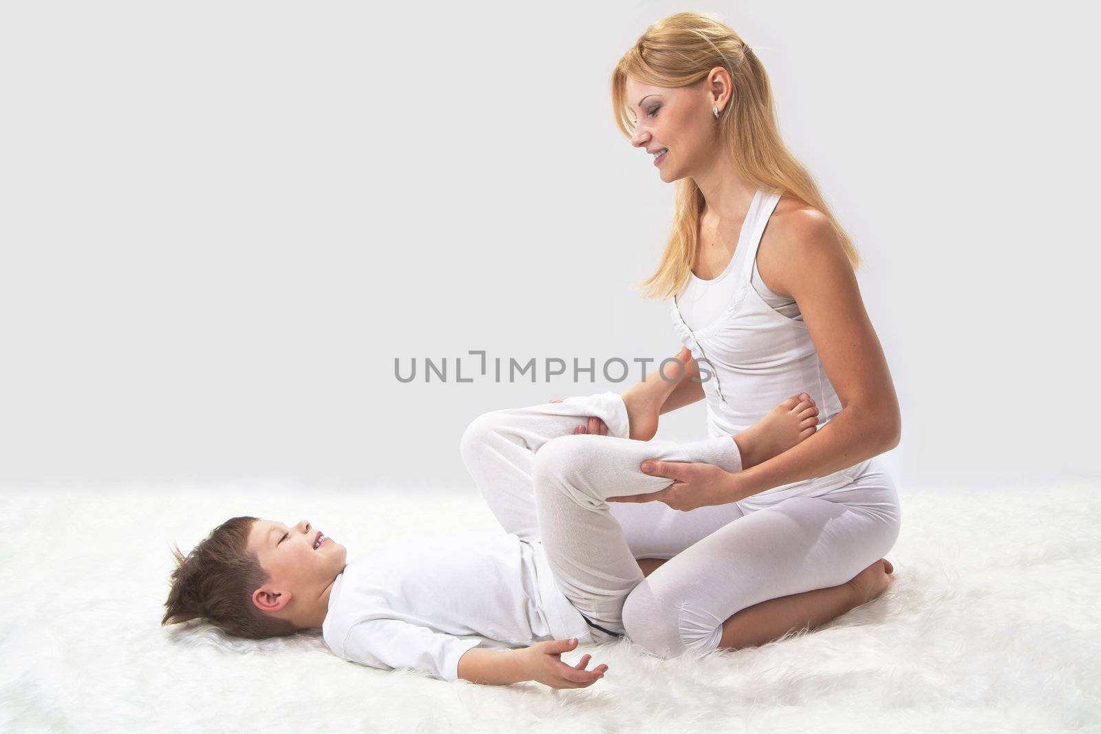 Mother and son do yoga before bed