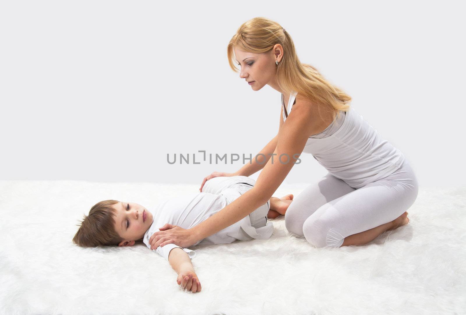 Mother and son do yoga before bed