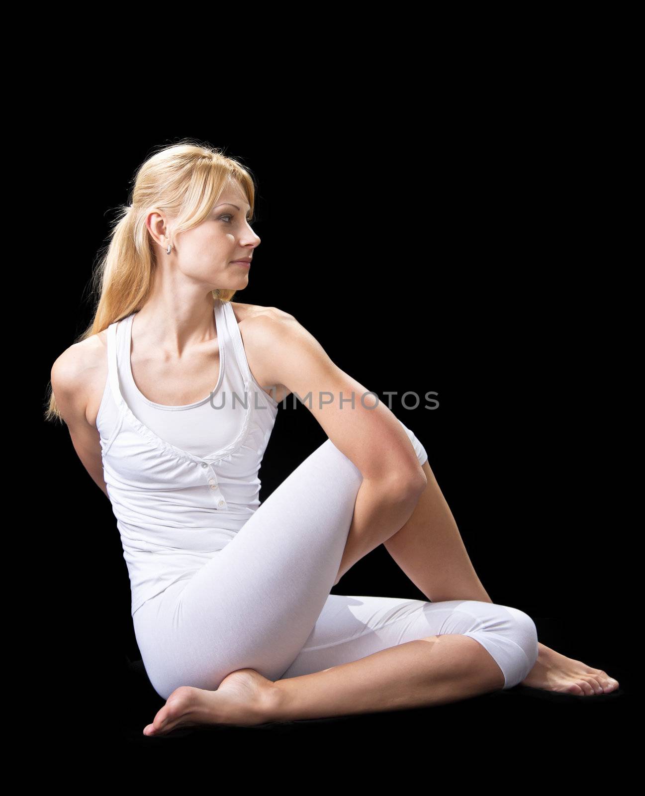 Young beautiful girl is professionally engaged in yoga  by NickNick