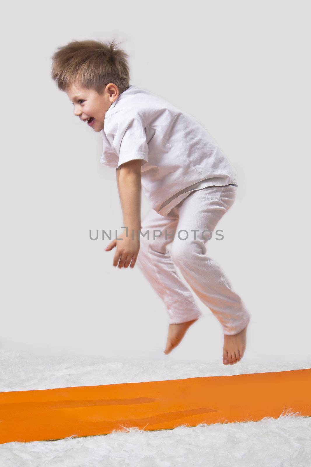 Kid jumps, doing yoga by NickNick