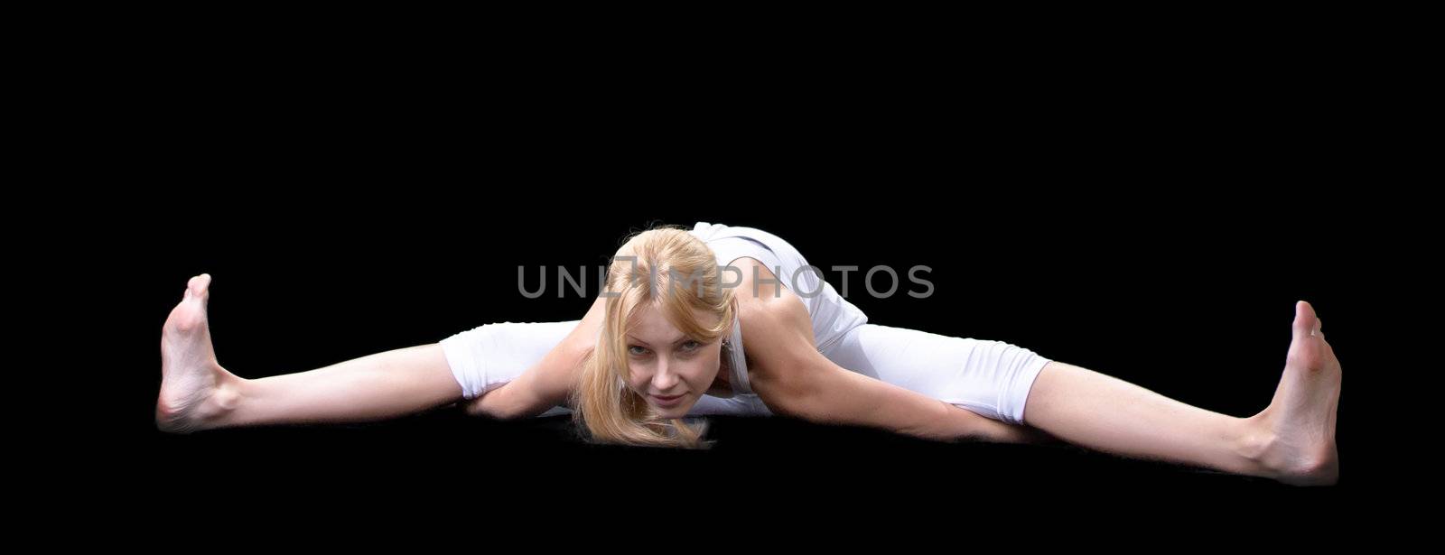 Young beautiful girl is professionally engaged in yoga  by NickNick