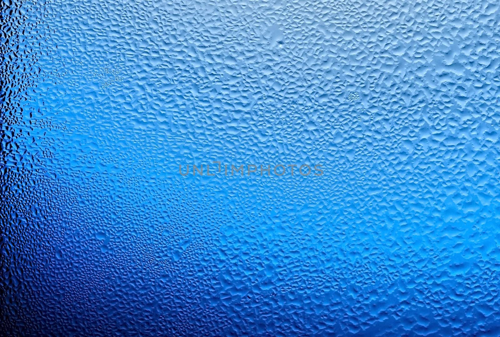 water drops on glass, color blue. 
