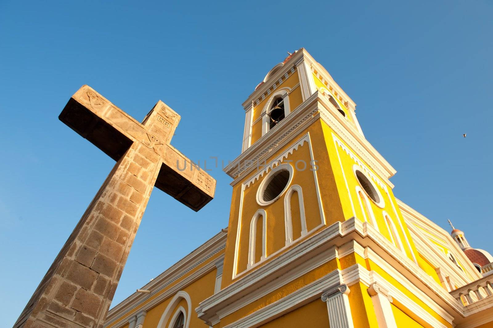 Cathedral and stone cross, Granada, Nicaragua, Central America.