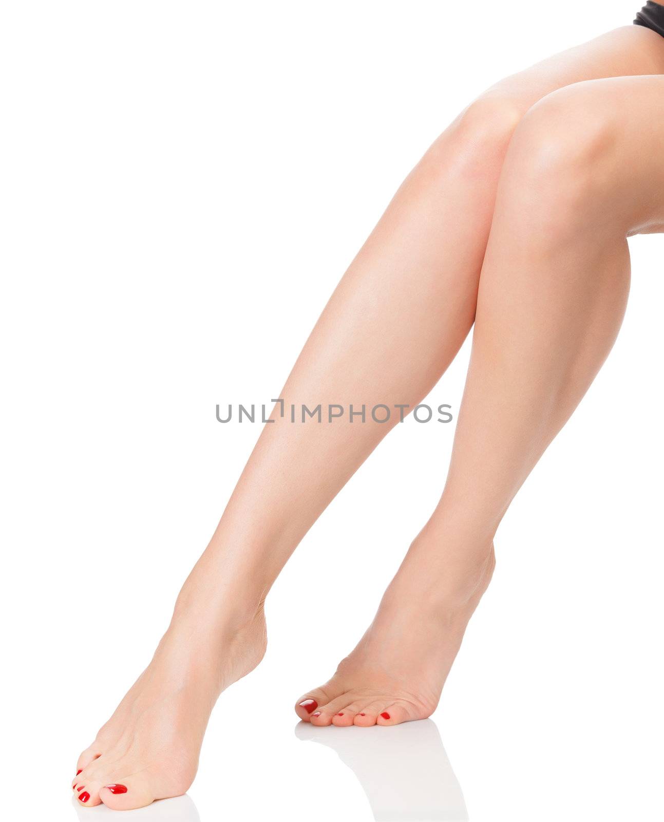 After depilation. Perfect long female legs against white background