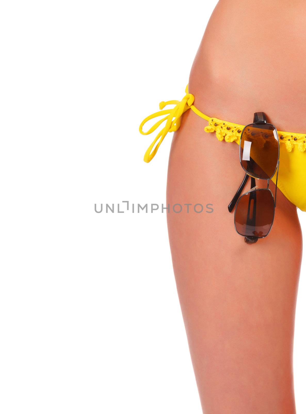tanned woman body in bikini, isolated on white. focus is on the sunglasses.