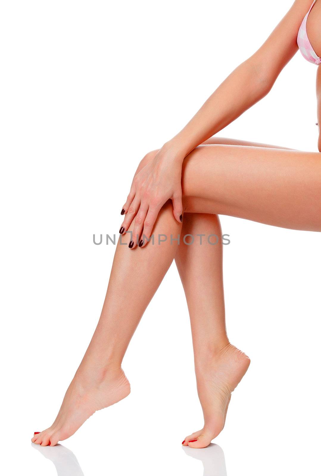 After depilation. Perfect long female legs against white background