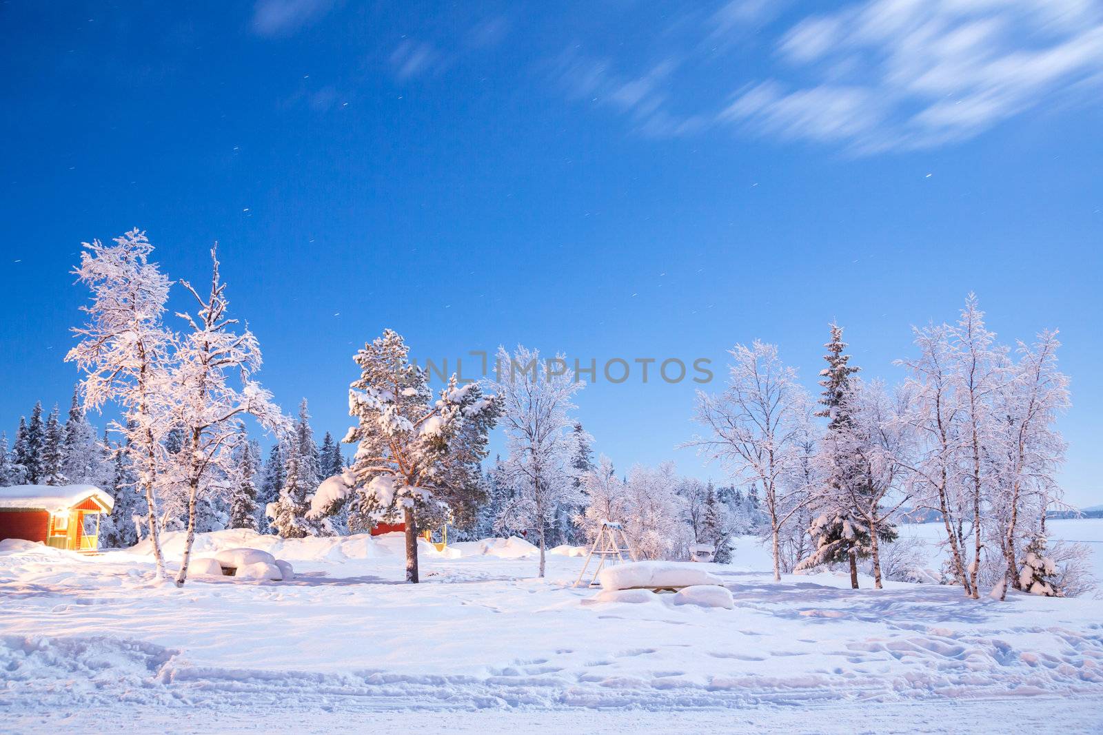 Garden and playground landscape in Winter at night in Kiruna Sweden at Night with star trail