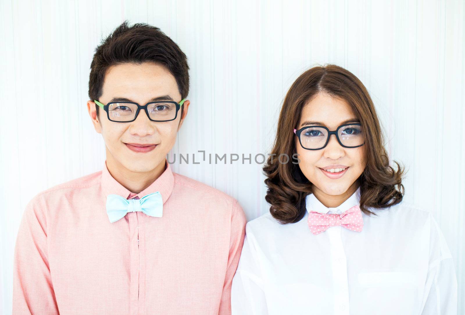 Happy Young Couples in living room with smart casual dress