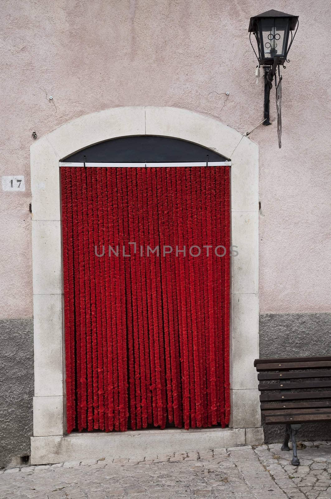 Red plush entrance in the mountain village of Pescocostanzo, region of Abruzzo, Italy.