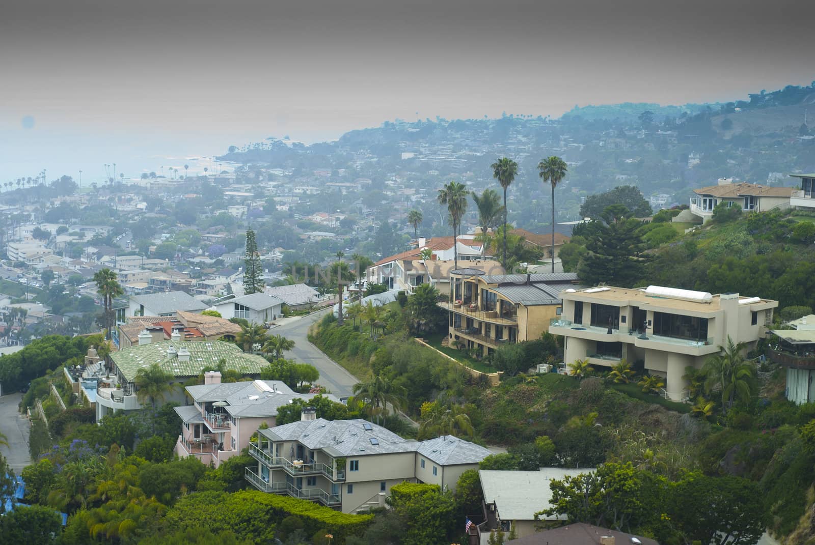 Looking down to Laguna Beach with big houses stacked on hill