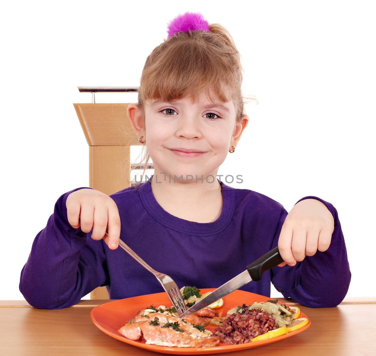 little girl eating a healthy lunch