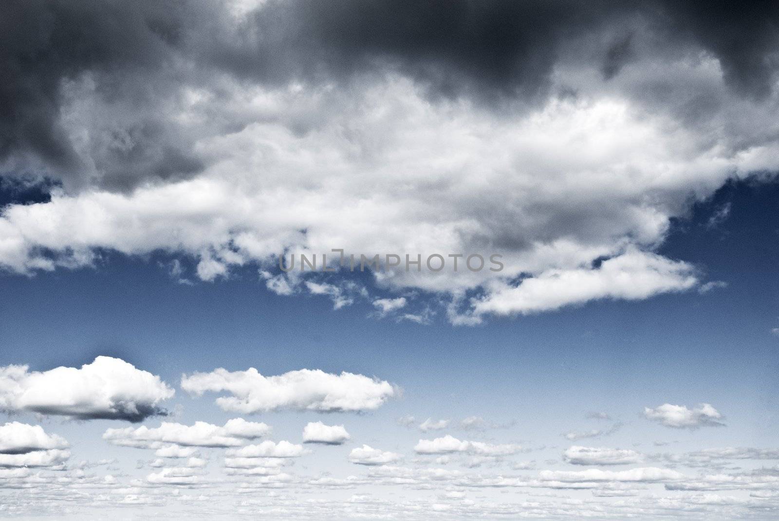 layers of moody, dramatic clouds going into distance