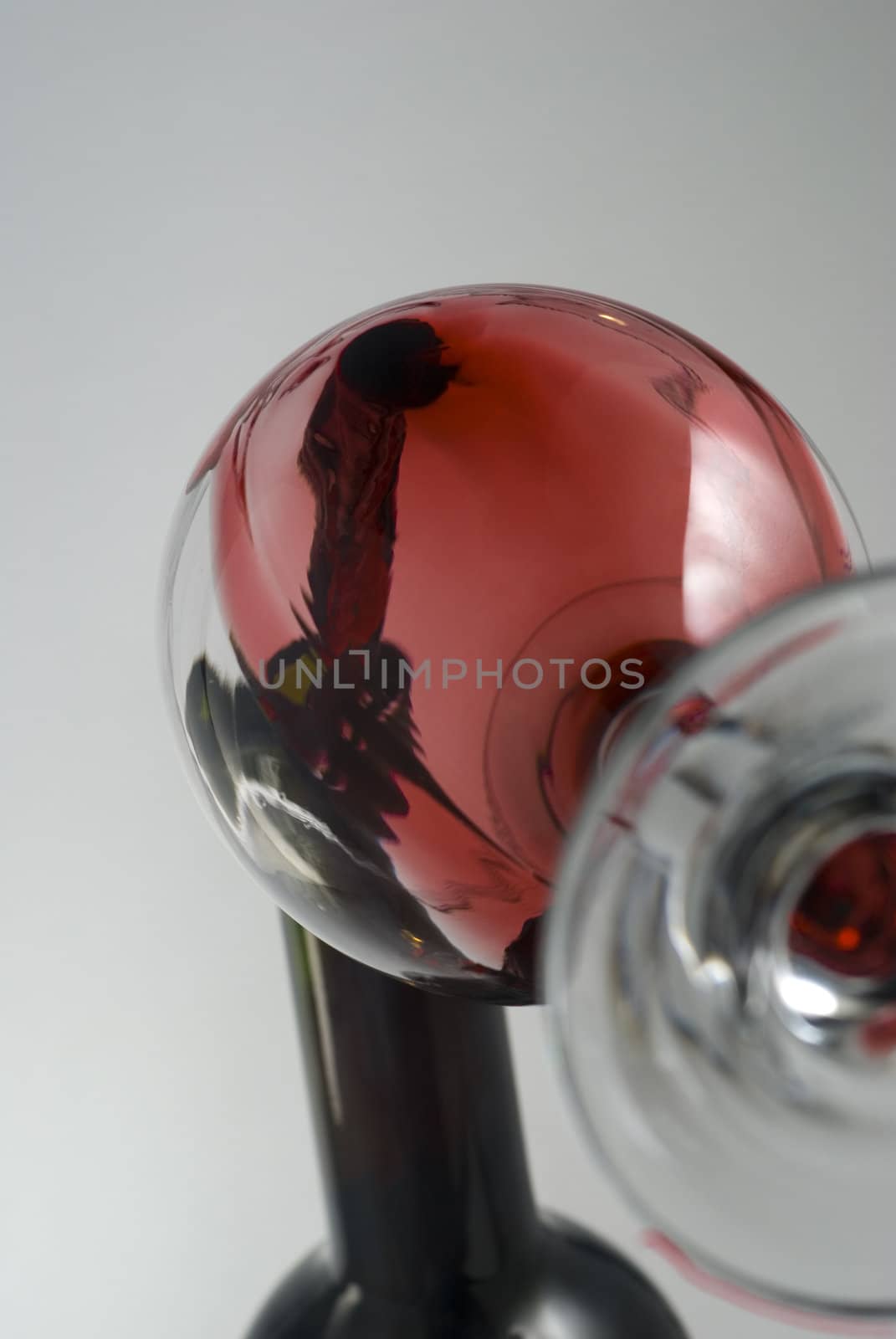 Wine pouring in a glass captured from unusual POV stock photo