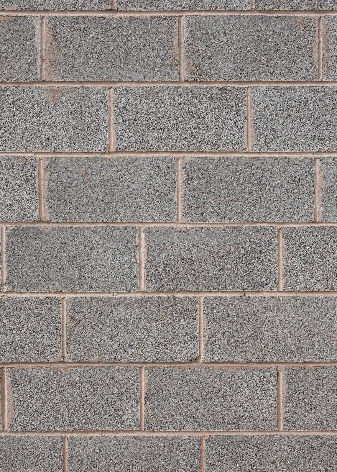Closeup detail of a grey breeze block wall