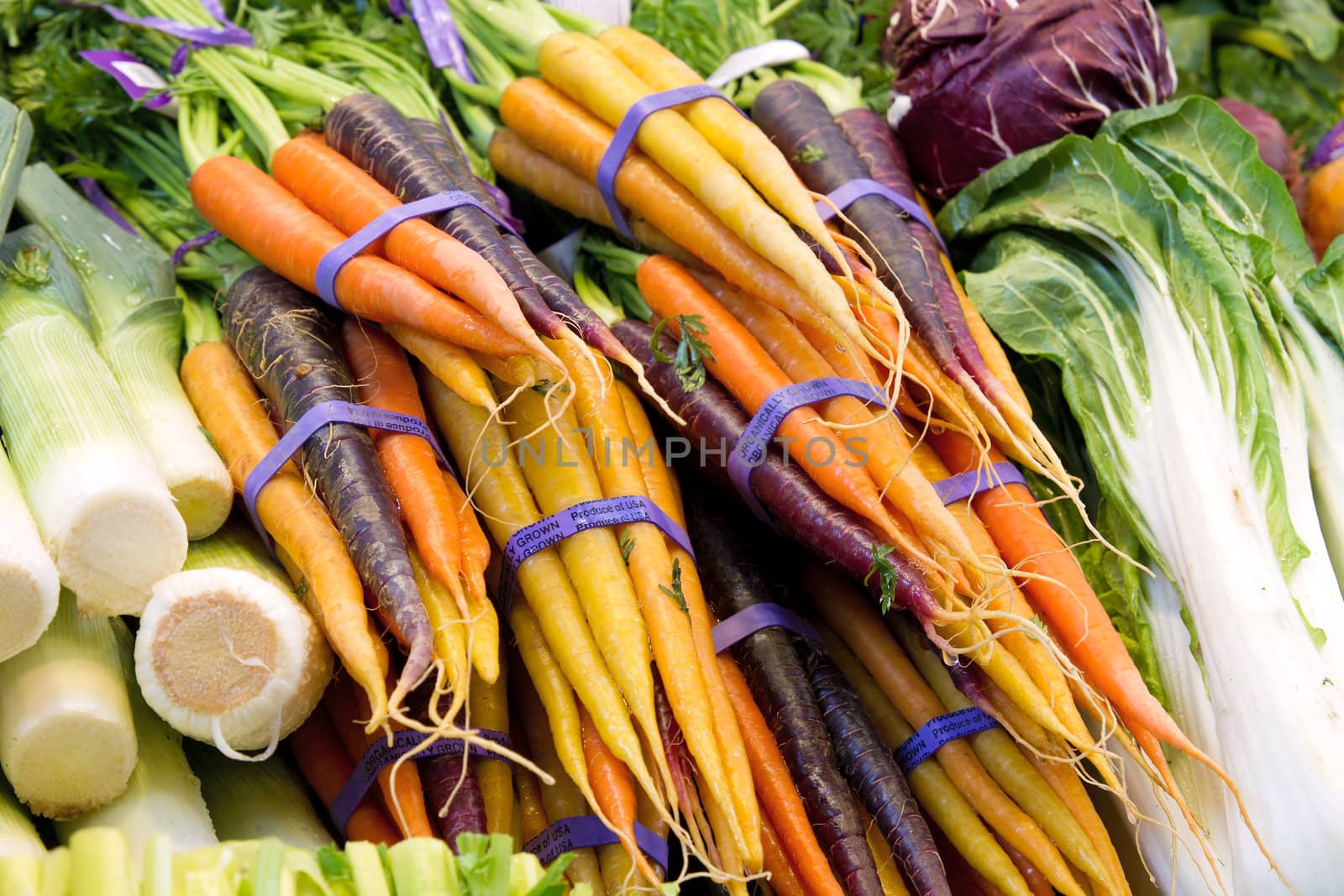 Organically Grown in the USA Carrots and Vegetable at Market Stall