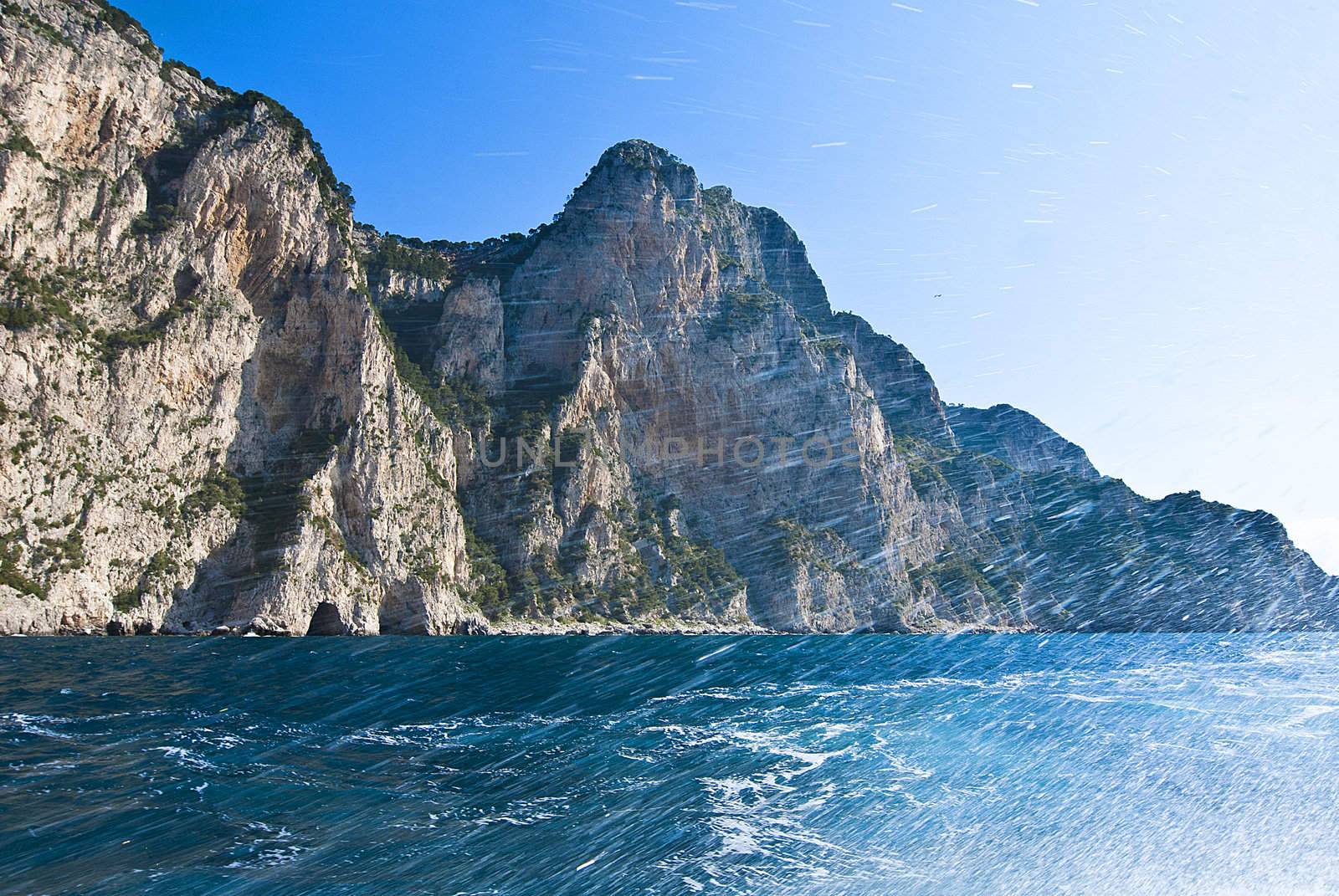 rugged cliffs falling into mediterannean sea capri, italy